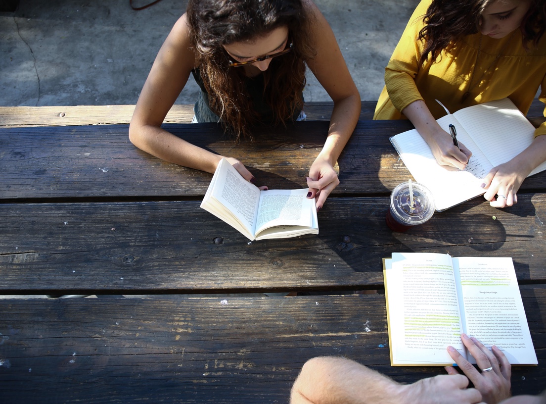 group of women reading and writing